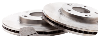 Two shiny silver brake rotors with a brake pad in front on a white background