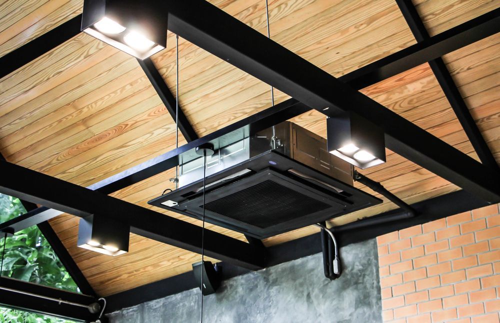 A Ceiling Fan is Hanging From the Ceiling of a Building — Enterprise Air That's Cool in Bucca, QLD