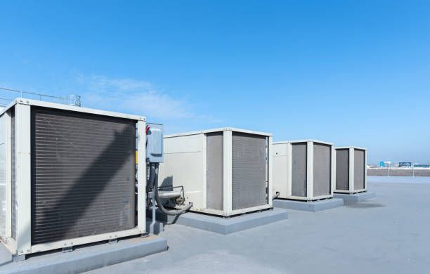 A Row of Air Conditioners Are Sitting on Top of a Roof — Enterprise Air That's Cool in Innes Park, QLD