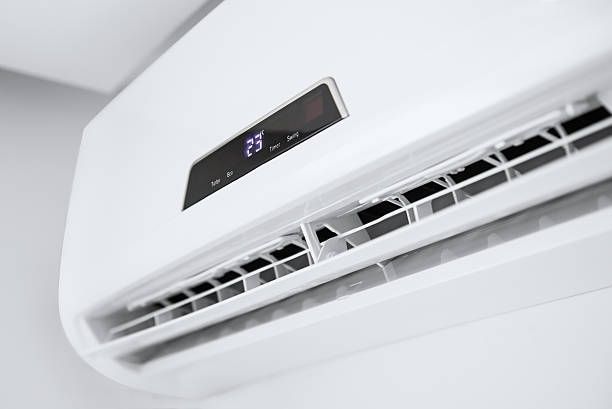 A Close Up of a White Air Conditioner Hanging on a Wall — Enterprise Air That's Cool in Innes Park, QLD