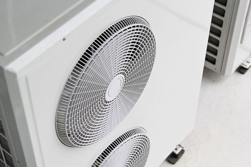 Two Fans Are Sitting Next to Each Other on a White Surface — Enterprise Air That's Cool in Svensson Heights, QLD
