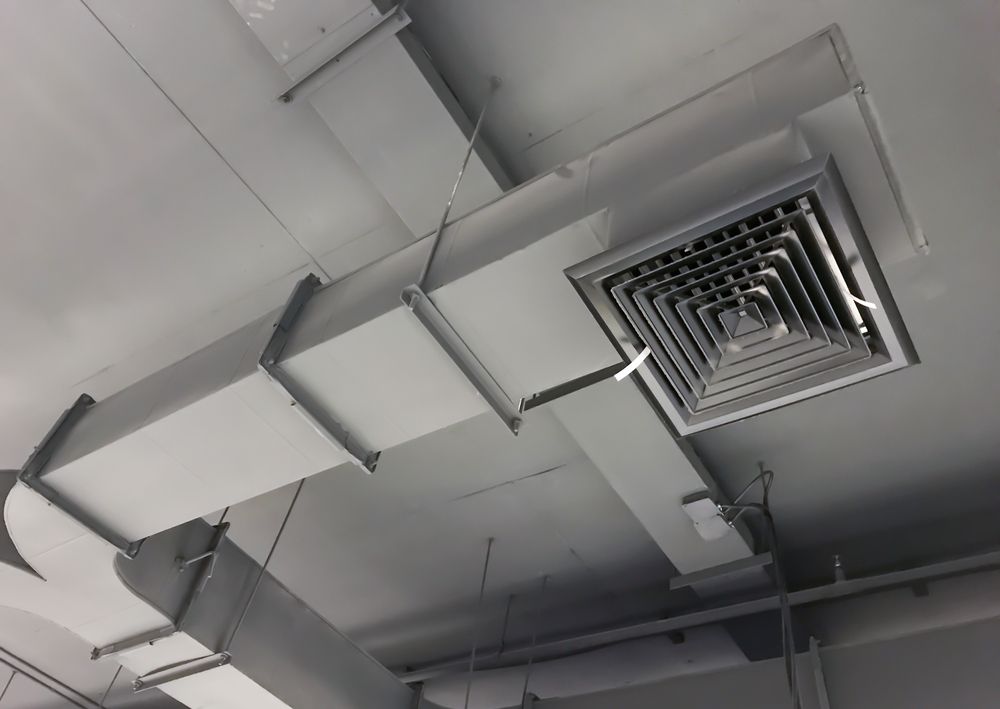 A Black and White Photo of a Ceiling With Ducts and Vents — Enterprise Air That's Cool in Svensson Heights, QLD