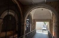 Cells with arches and a ramp leading to it.