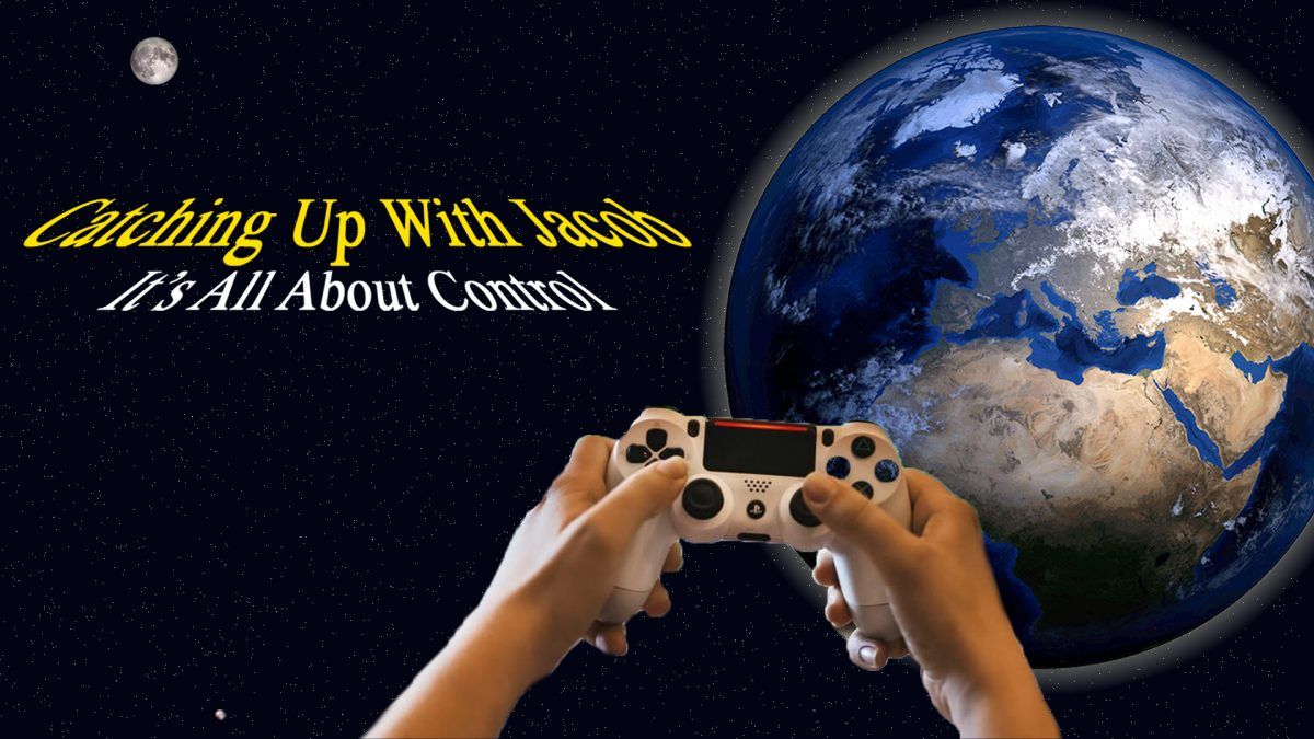 A person is holding a video game controller in front of the earth