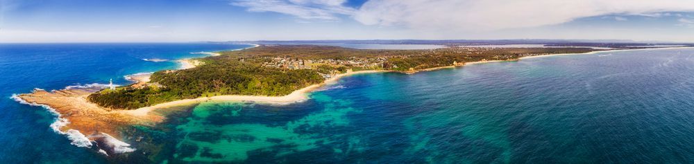 An Aerial View Of A Small Island In The Middle Of The Ocean — Castledine's Truck Painting & Repairs in Tuggerah, NSW
