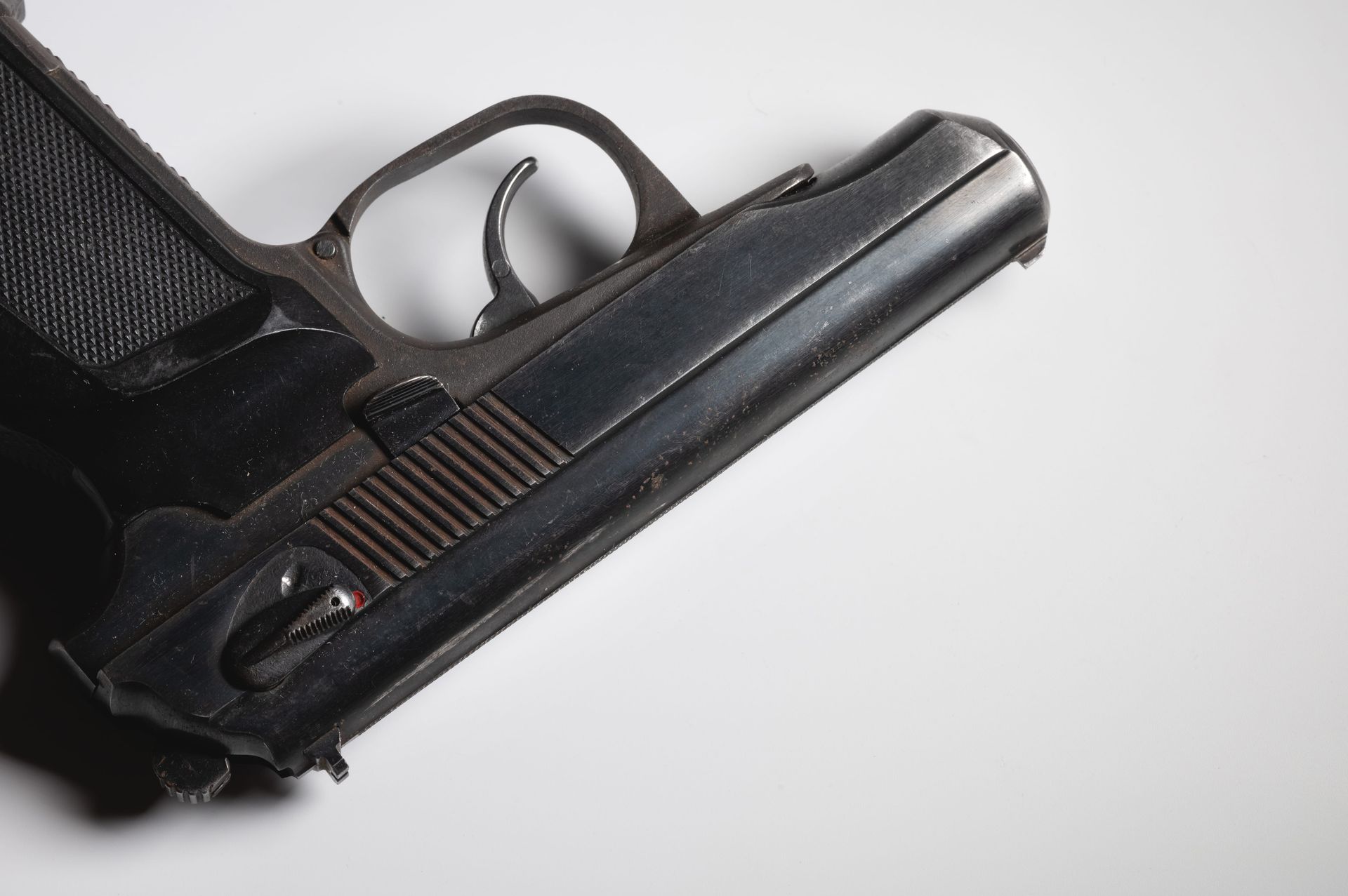Close-up of a black handgun in a holster