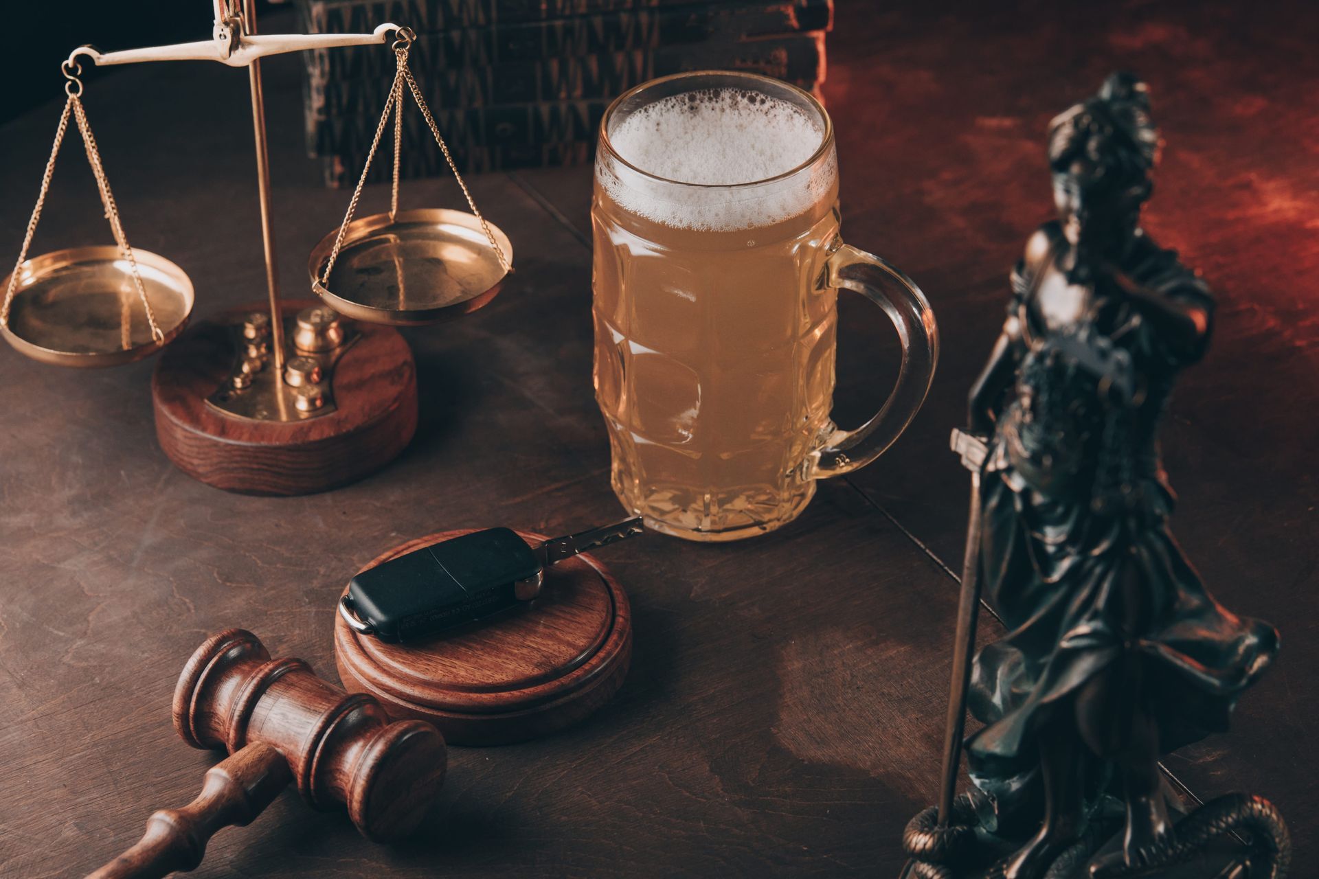 Law office desk with scales, gavel, chess pieces, and a frothy beer mug