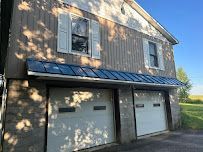 Front House with Garage Doors — Erie, PA — Advanced Roofing and Construction