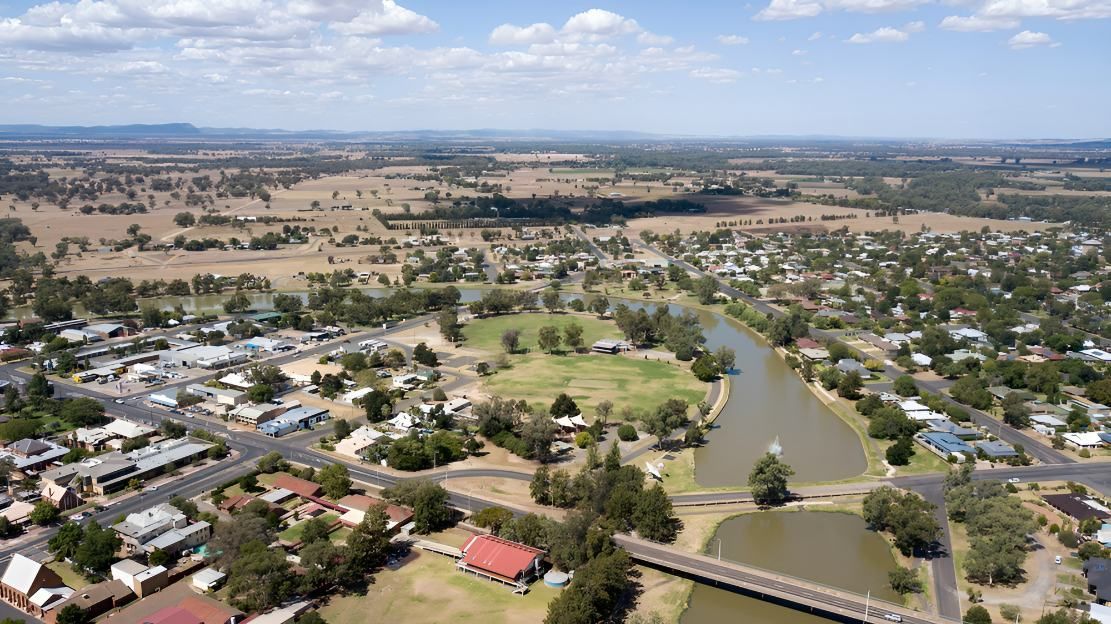 An Aerial View of a Small Town With a Bridge Over a River — Twin Towns Denture Clinic In Hawks Nest, NSW