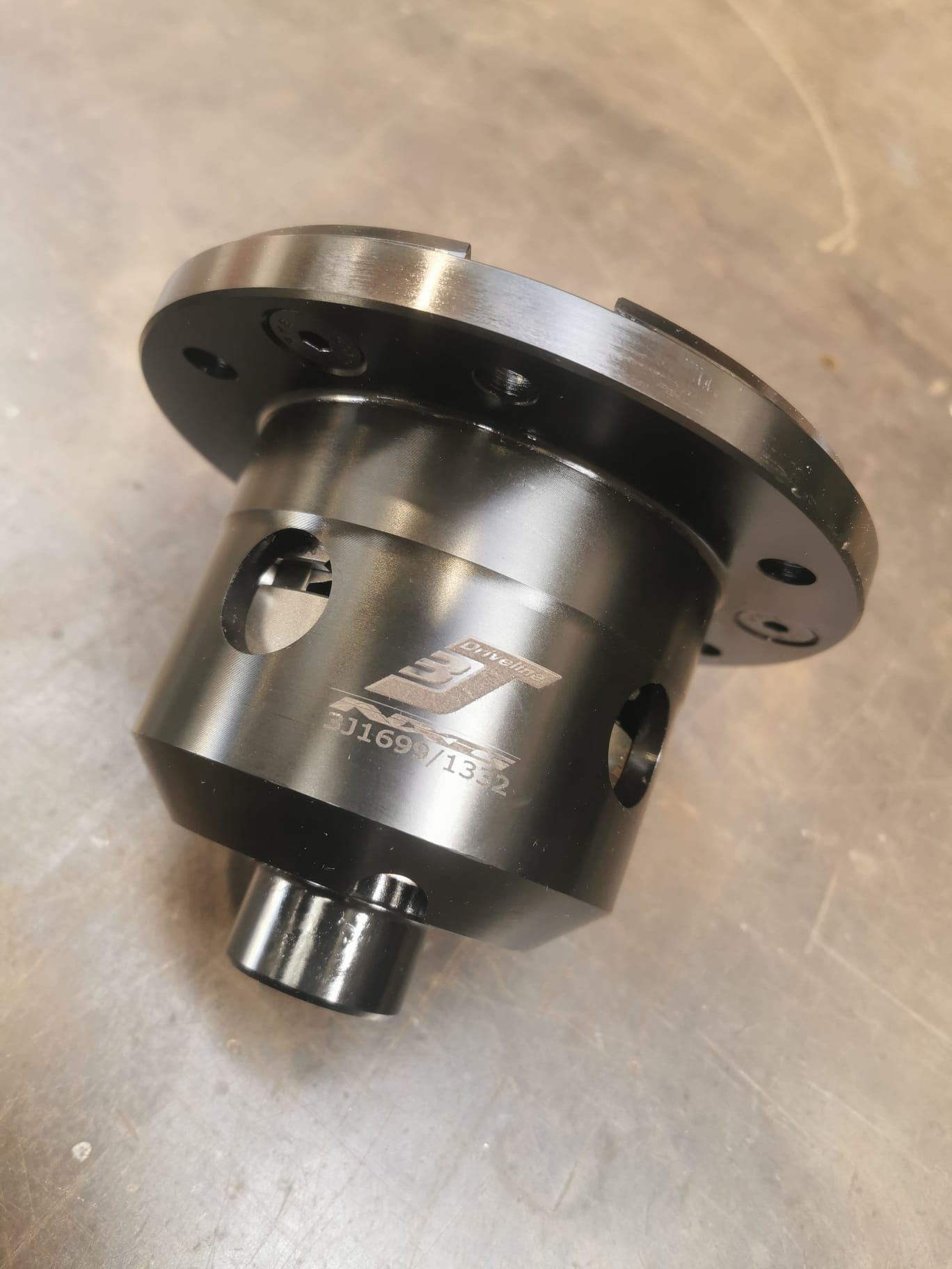 A lathe is being used to cut a piece of metal.
