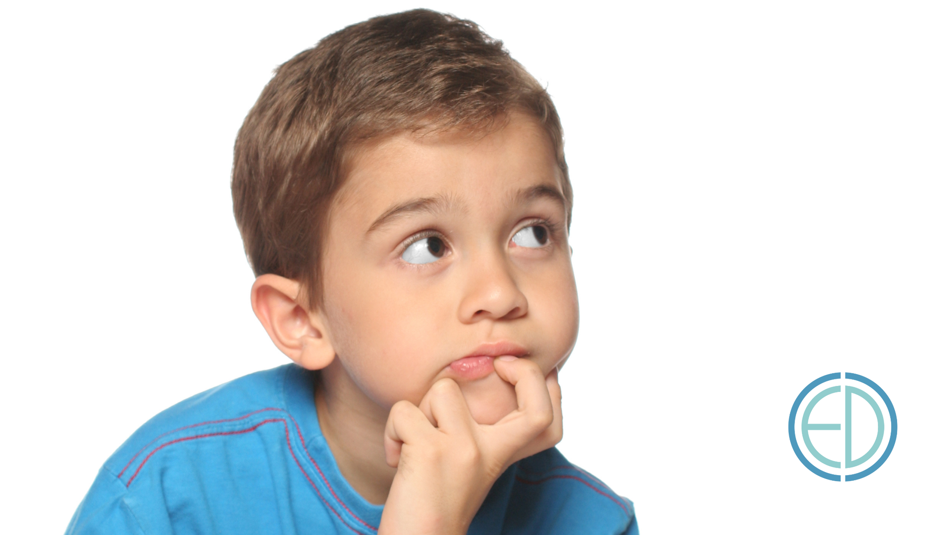 Boy in blue shirt looking up, finger on chin, appears thoughtful.