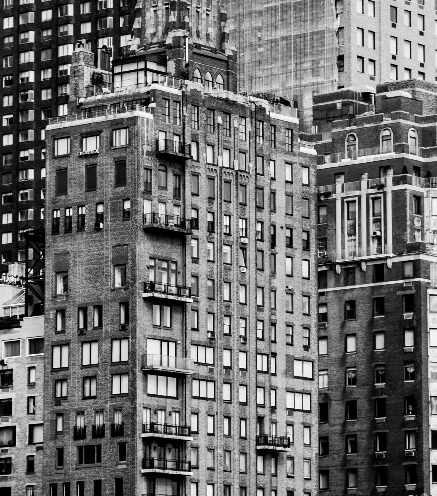 Black-and-white photo of tall apartment buildings in a dense city skyline — architectural photography