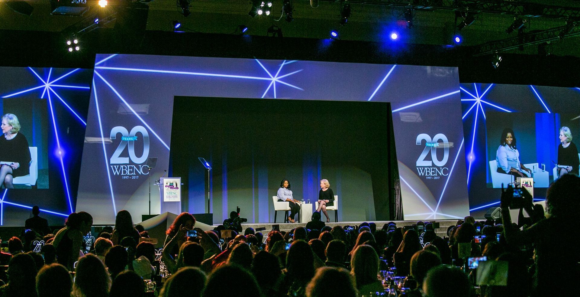 Large stage event with speakers, blue lighting — Las Vegas photography