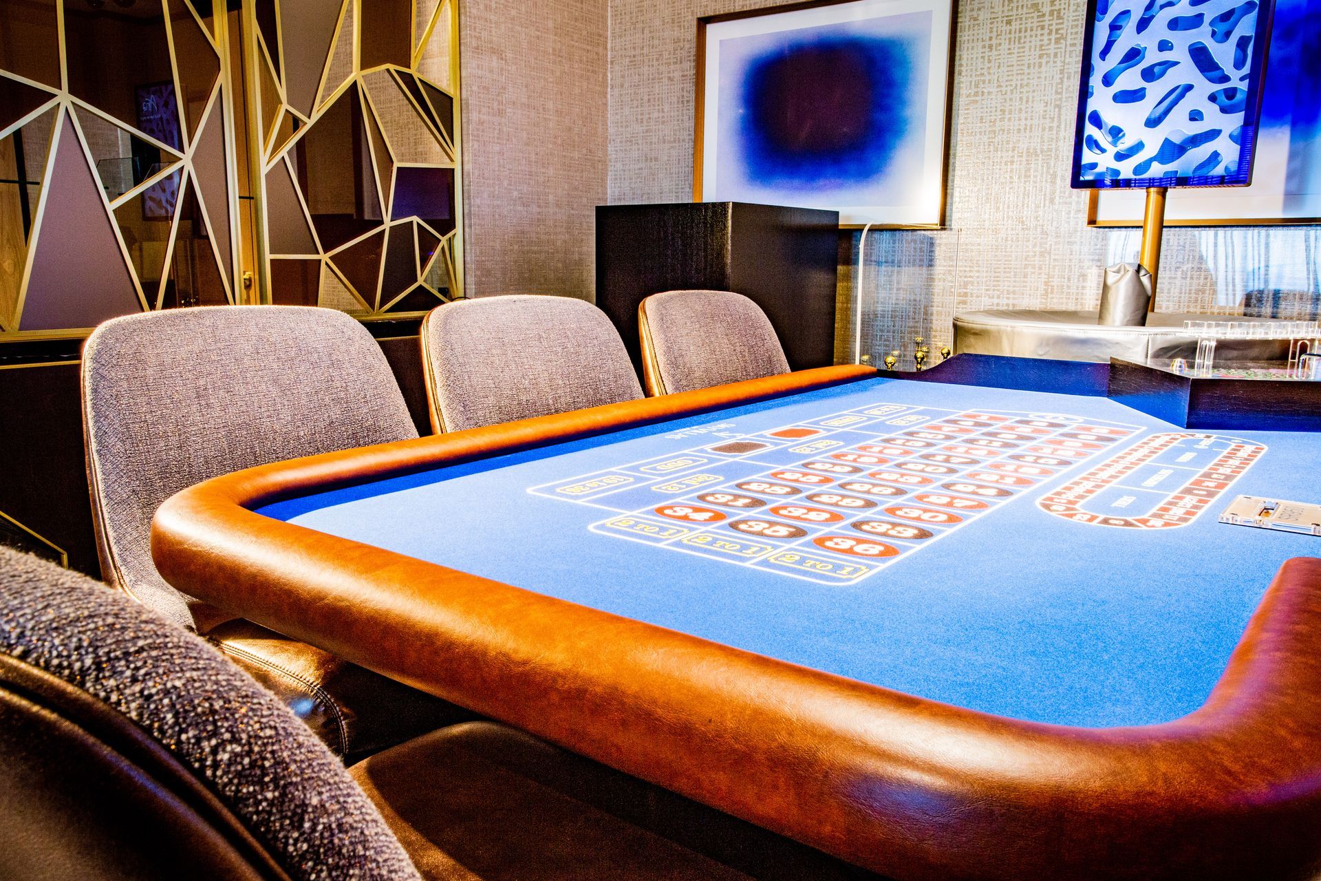 Casino card table with blue felt, orange edge — multi-family photography