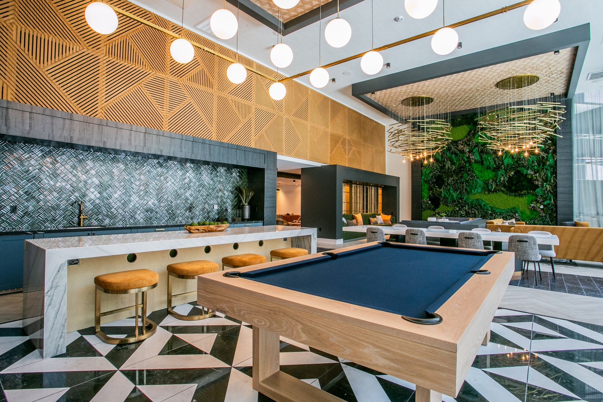 Stylish lounge with pool table, geometric floor, hanging globe lights — Las Vegas photography