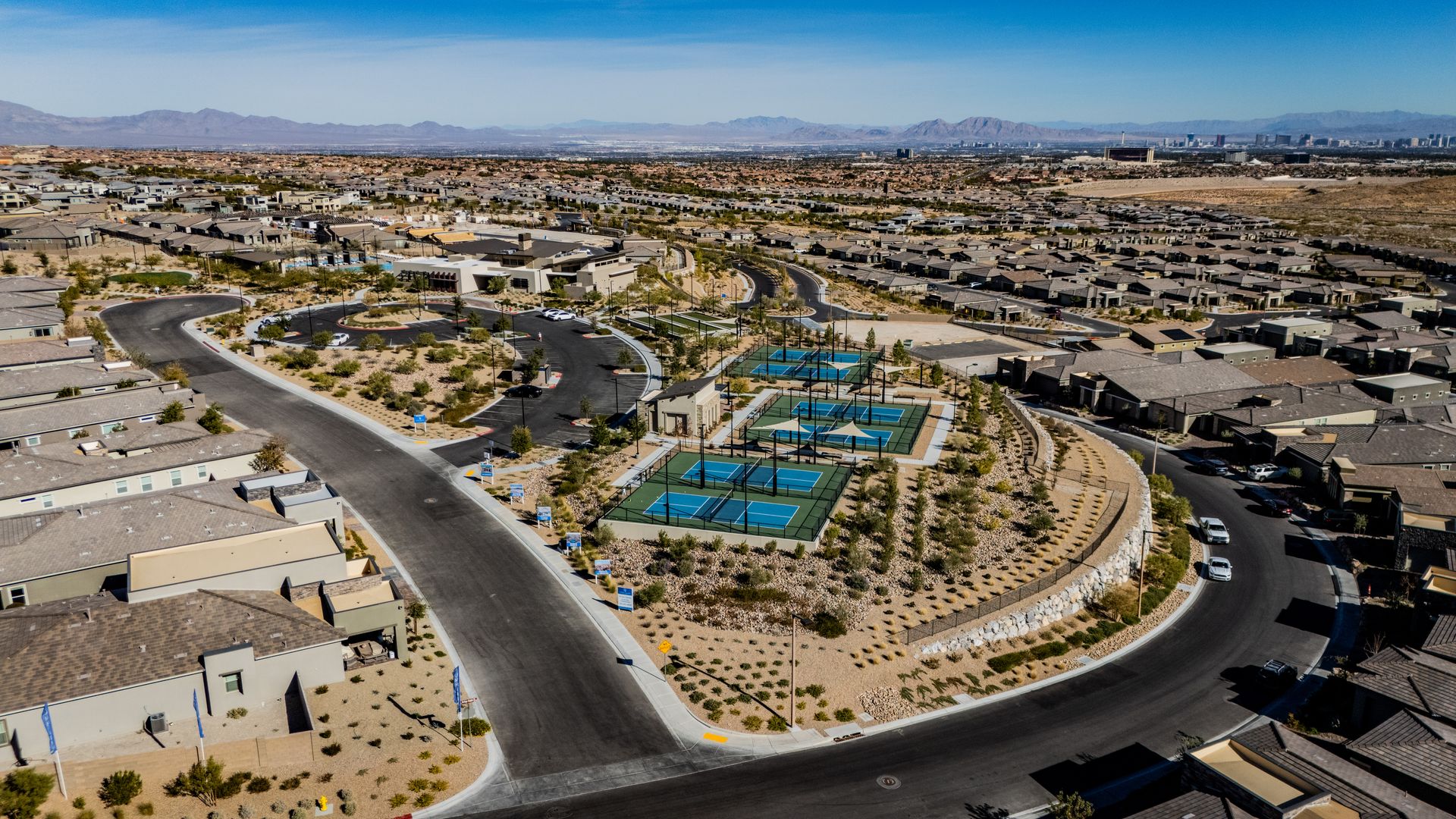 Aerial view of a suburban neighborhood with roads, houses — photography