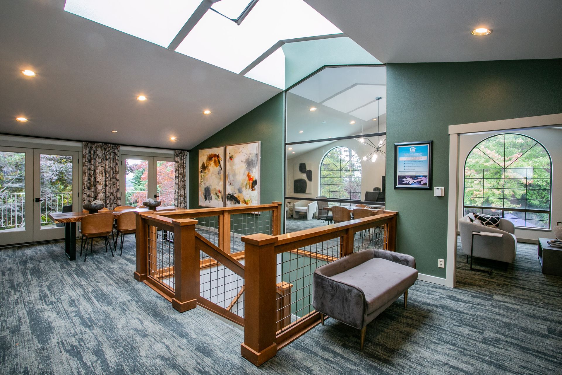 Modern office lobby with glass railings, gray seating — Las Vegas multi-family photography