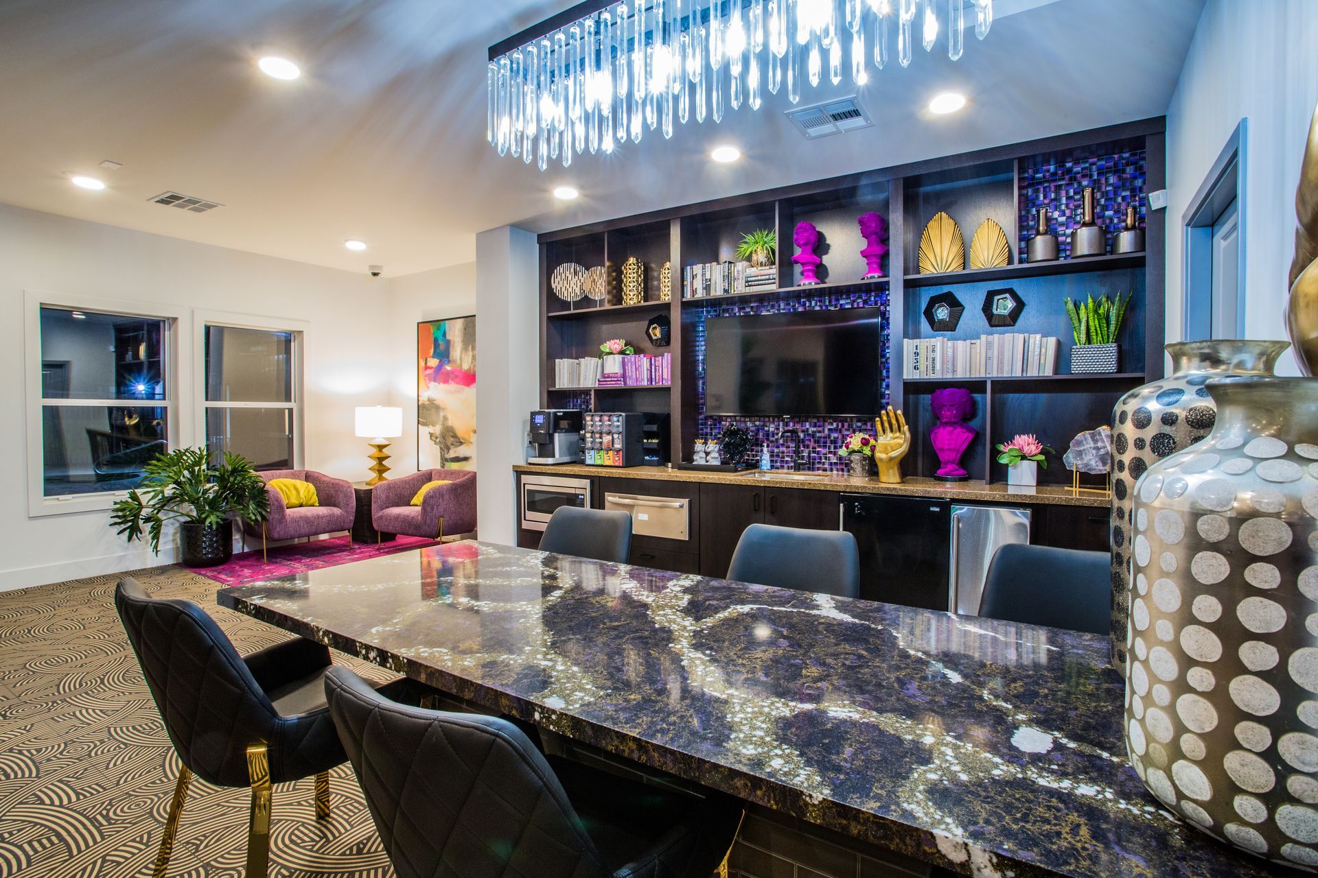 Modern living room with a glossy black dining table, chandelier, shelves — multi-family photography