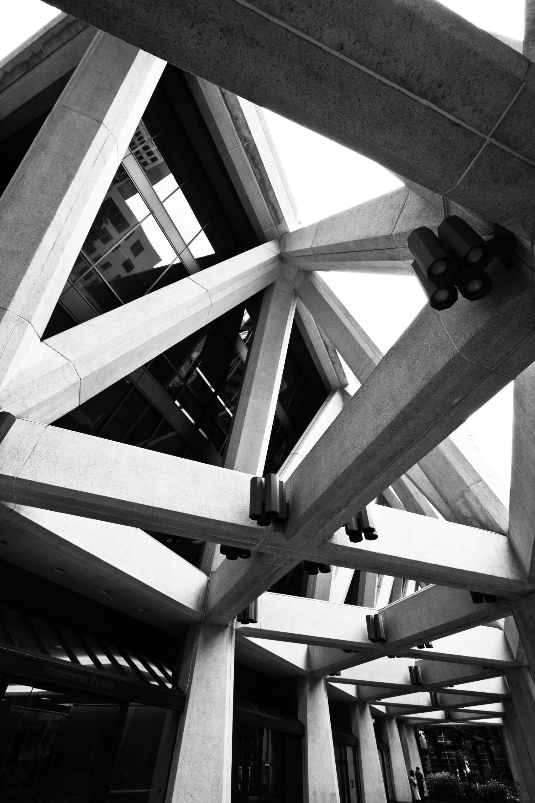 Black-and-white view of steel beams and trusses forming an — Las Vegas architecture photography