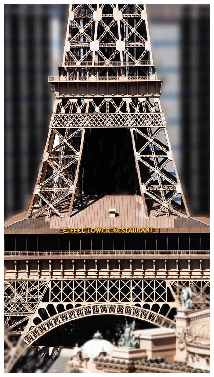Eiffel Tower close-up, showing the iron lattice and lower arch — Las Vegas architecture photography