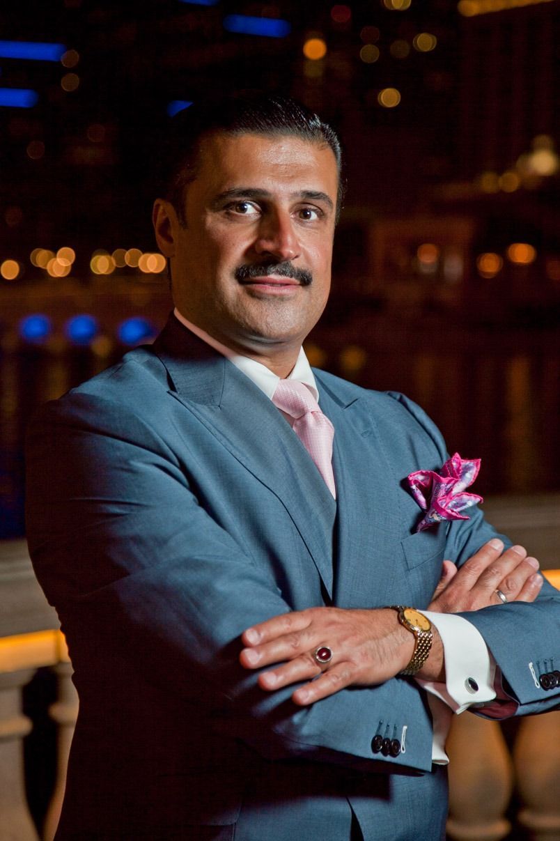 Man in a blue suit with a pink tie and pocket square — Las Vegas portrait photography