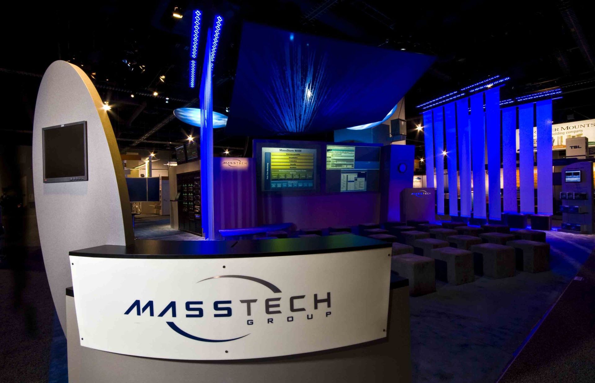 MassTech booth with blue lighting at a trade show or expo — Las Vegas commercial advertising photography
