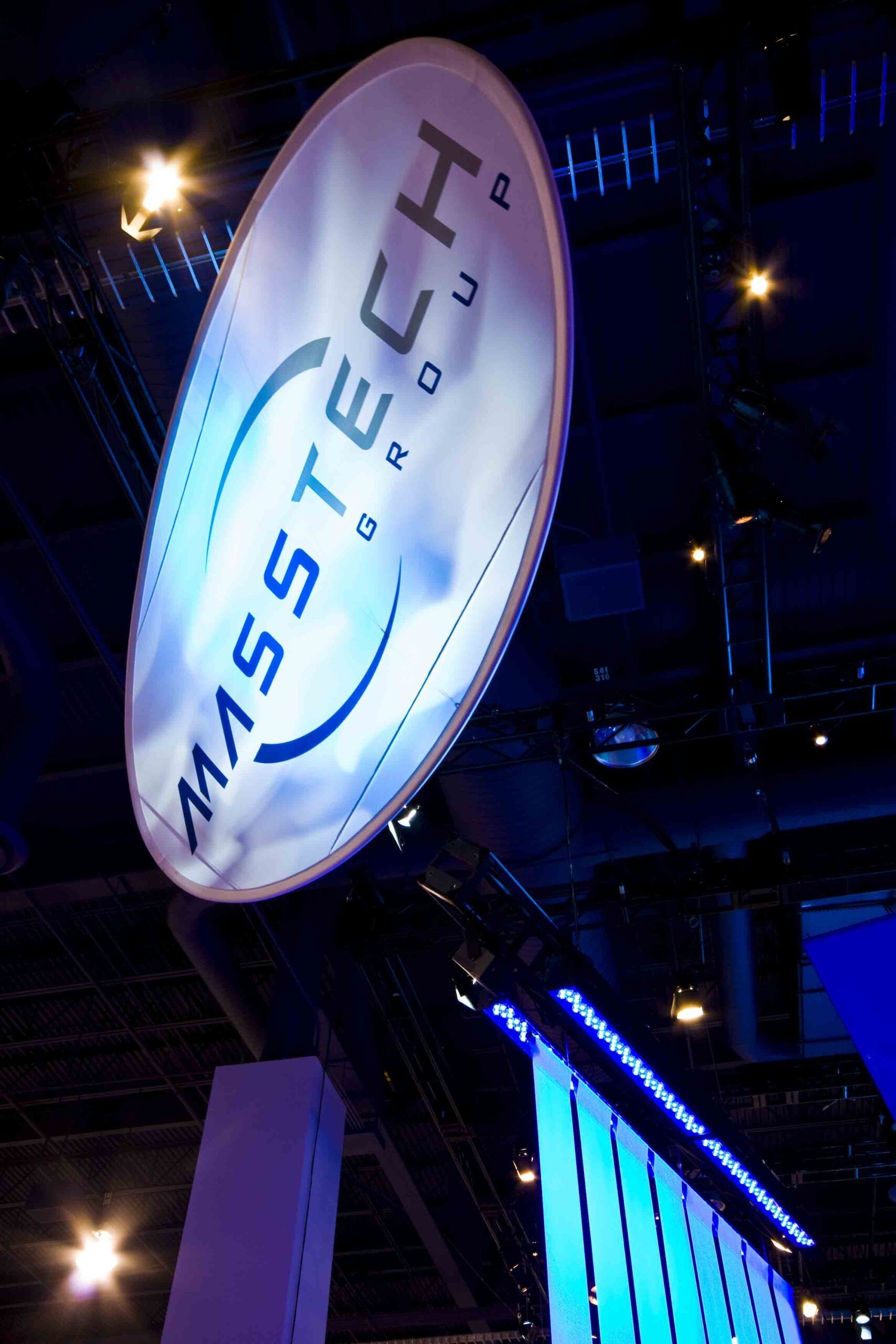 Illuminated MasterChef logo sign hanging indoors with blue accent lighting — Las Vegas commercial advertising photography