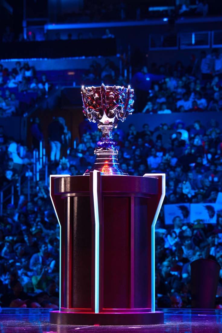 A trophy on a pedestal in a blue-lit arena — Las Vegas event photography