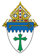 A shield with a green cross and a key on it
