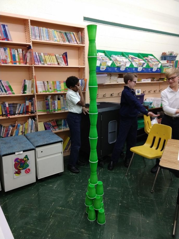 A stack of green cups in a library