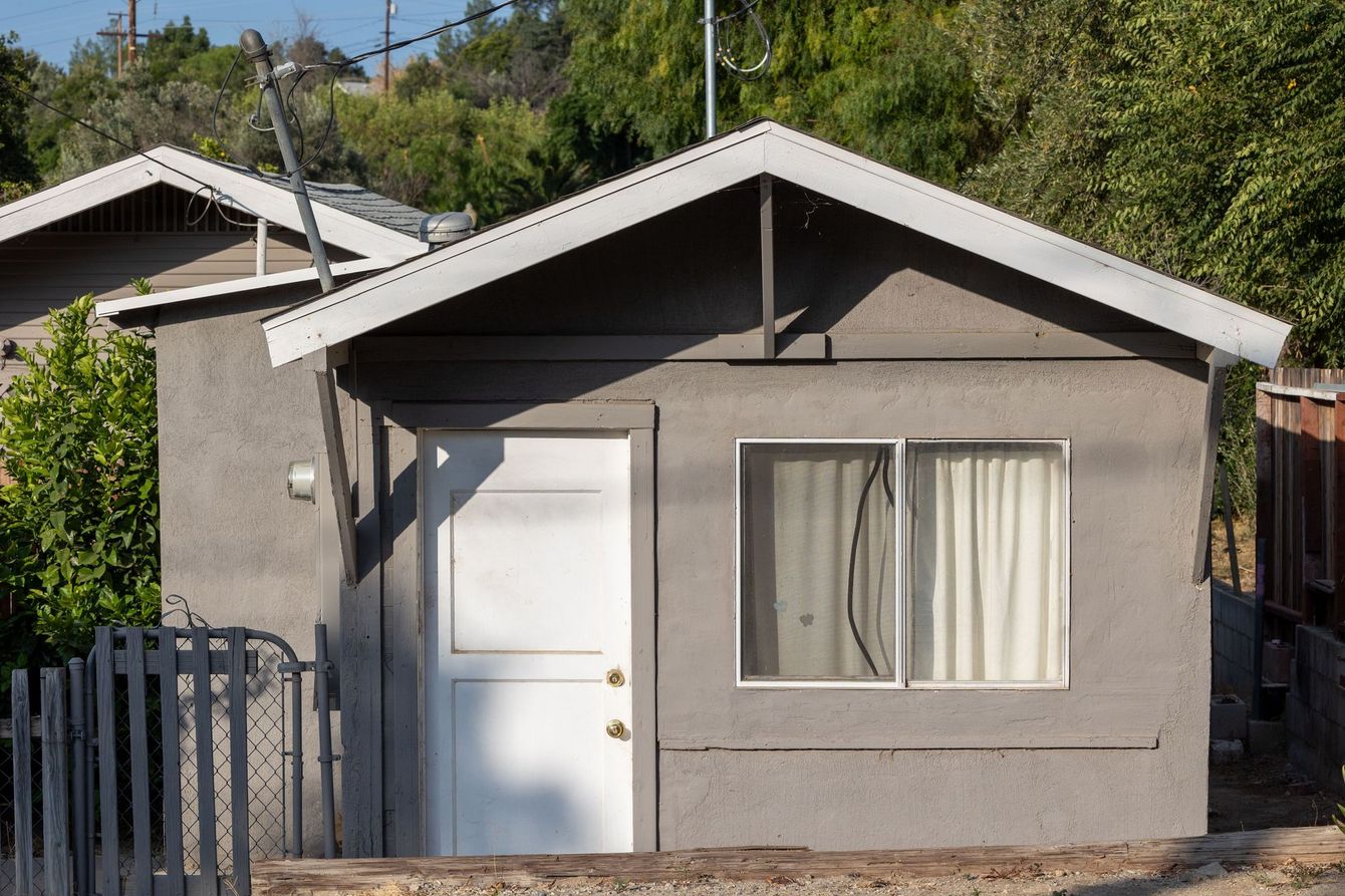 Newly completed backyard ADU by Lancaster ADU Pros, CA providing comfortable and modern accessory living space.