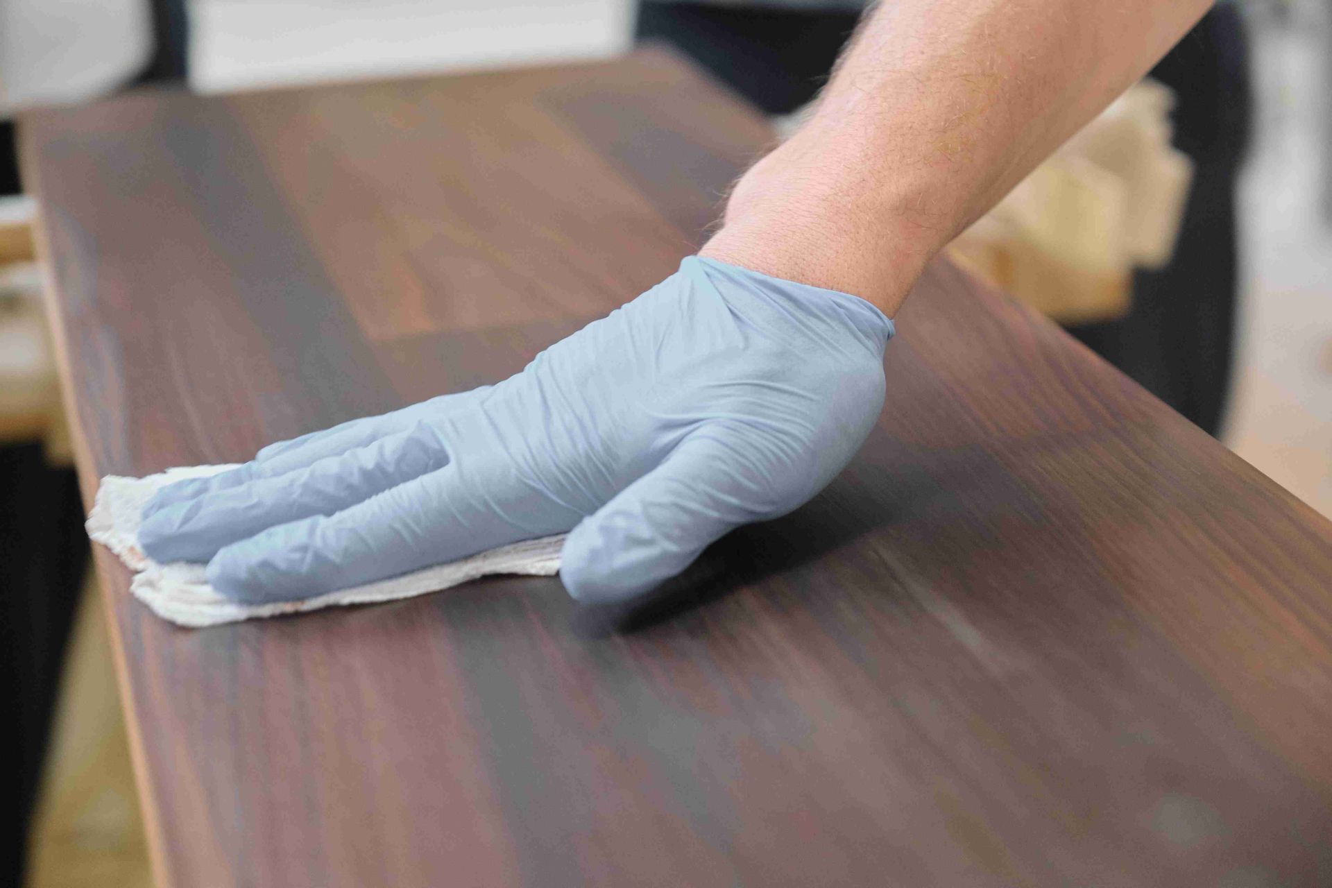 Wiping off a refinished cabinet