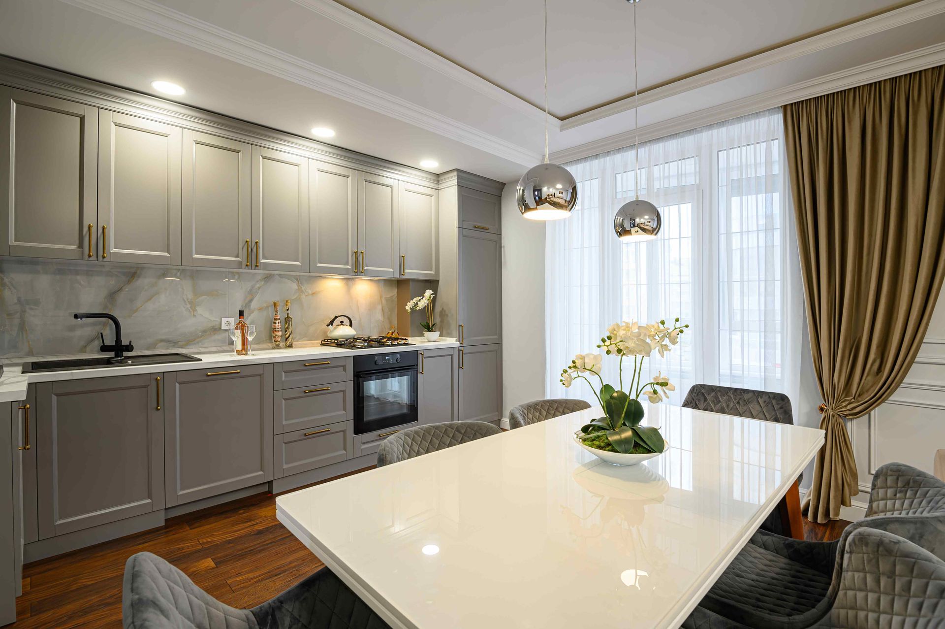 Some installed beige cabinetry in a kitchen