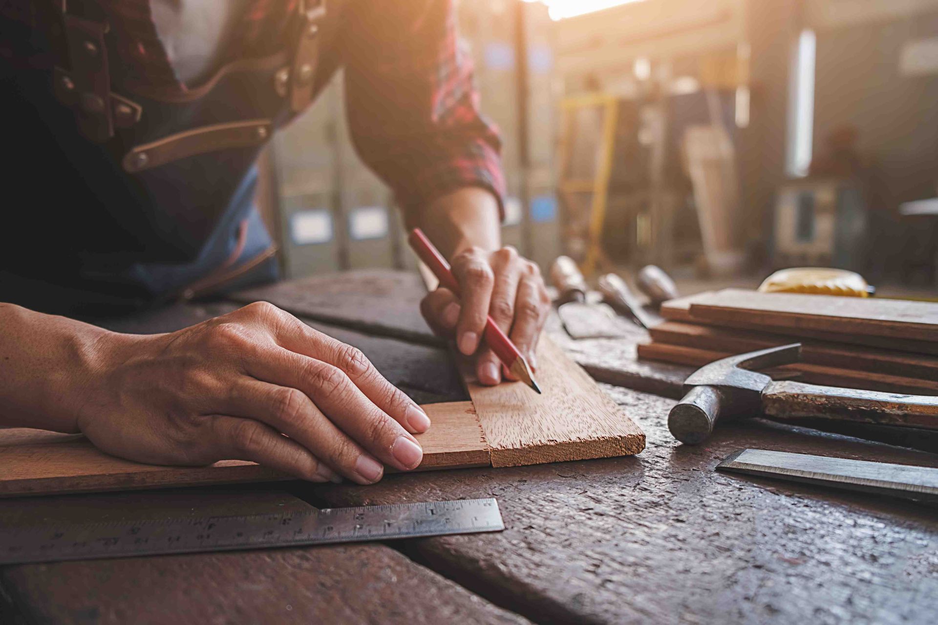 A man building custom cabinets for a bathroom and kitchen