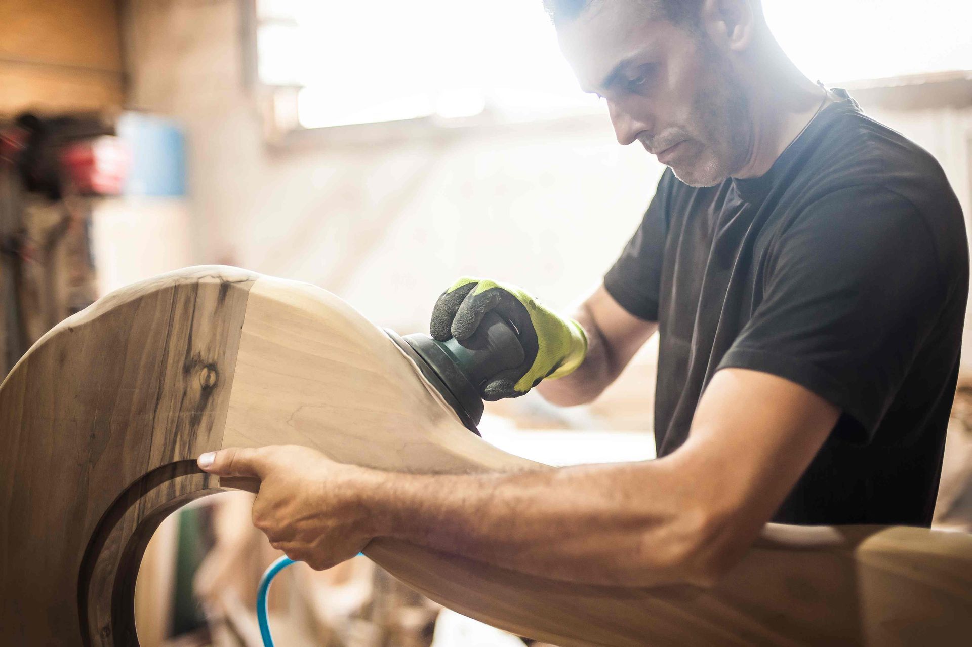 A man constructing cabinets for Evans home kitchen