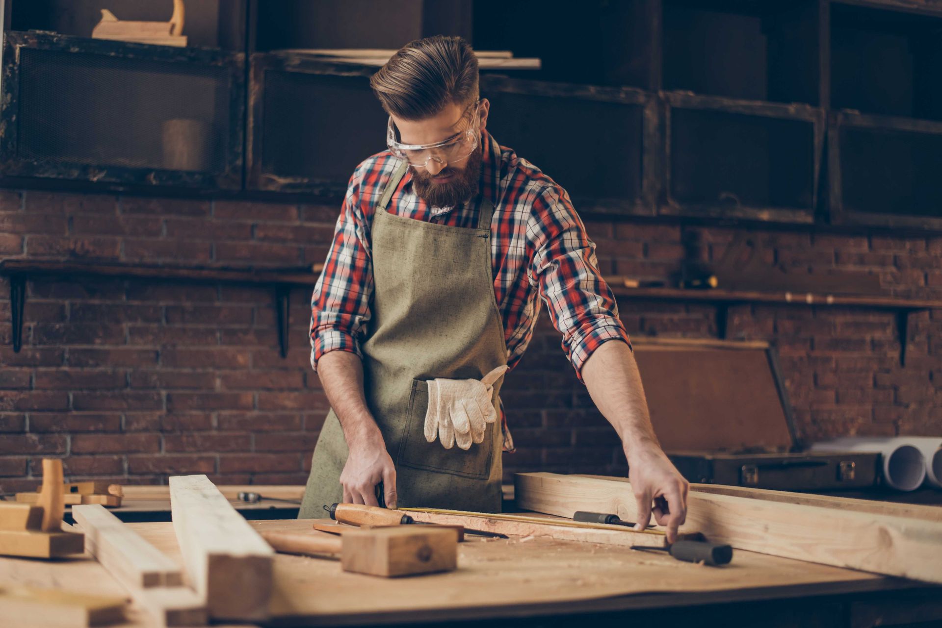 A man building great quality garage storage cabinetry