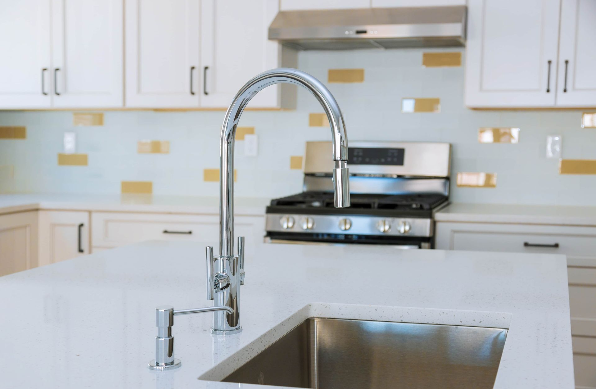 A sink with a shiny faucet