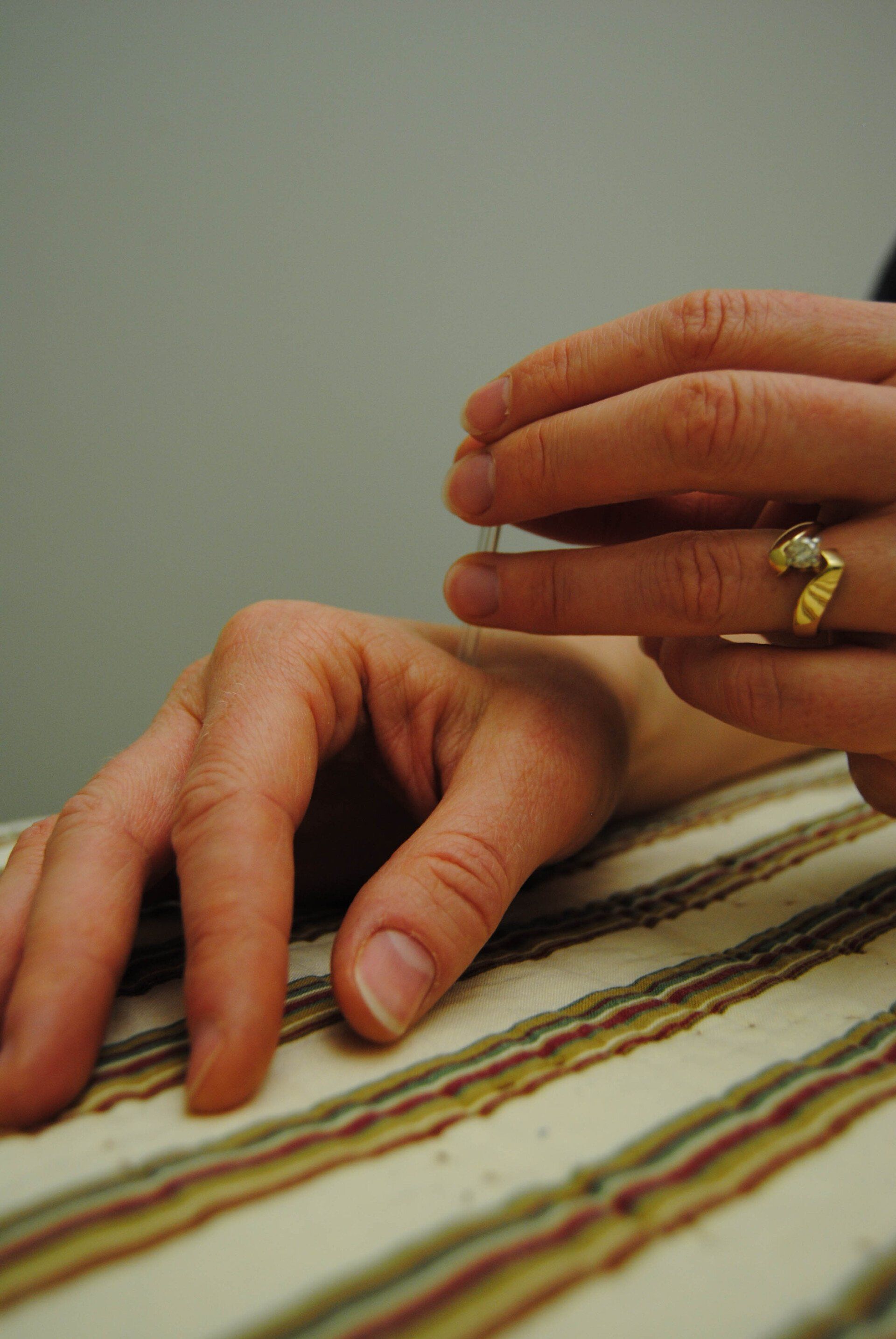 Hands Holding Something — Iowa City, IA — McDonald Chiropractic