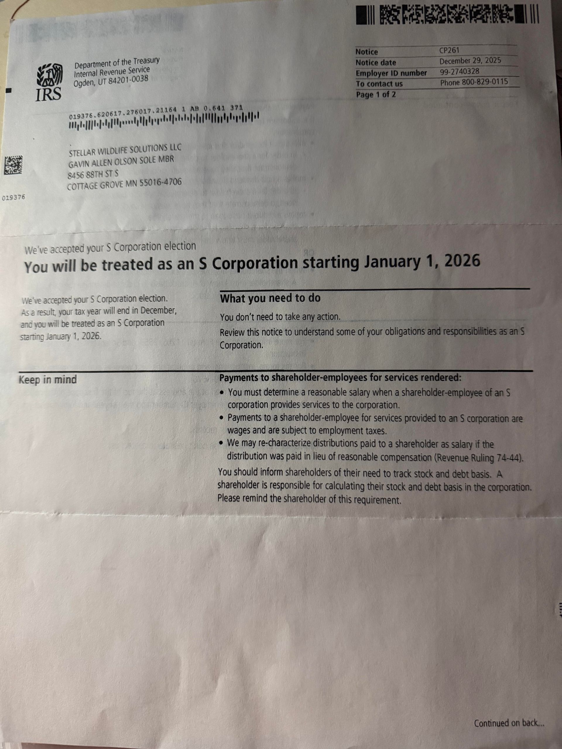 Blurry black-and-white photo of a printed letter on white paper with text and small header blocks.