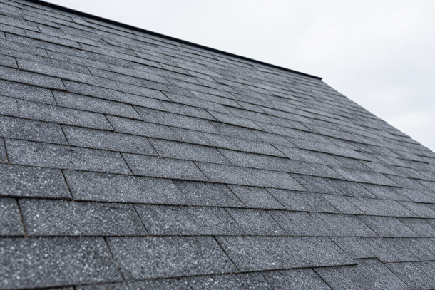 Charcoal asphalt shingles on a New England colonial roof