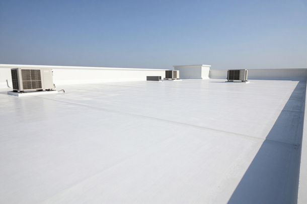 Commercial flat roof with white TPO membrane