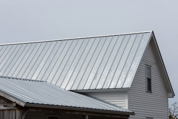 Standing-seam metal roof on a New England farmhouse
