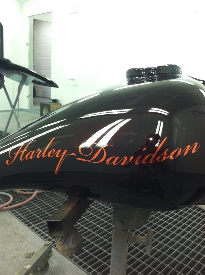 A harley davidson motorcycle is sitting on a table