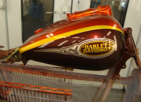 A harley davidson motorcycle is sitting on a stand