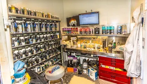 A room filled with lots of tools and paint.