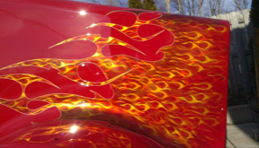 A red car with flames painted on it