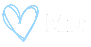 A blue heart is drawn on a white background next to the letter m.