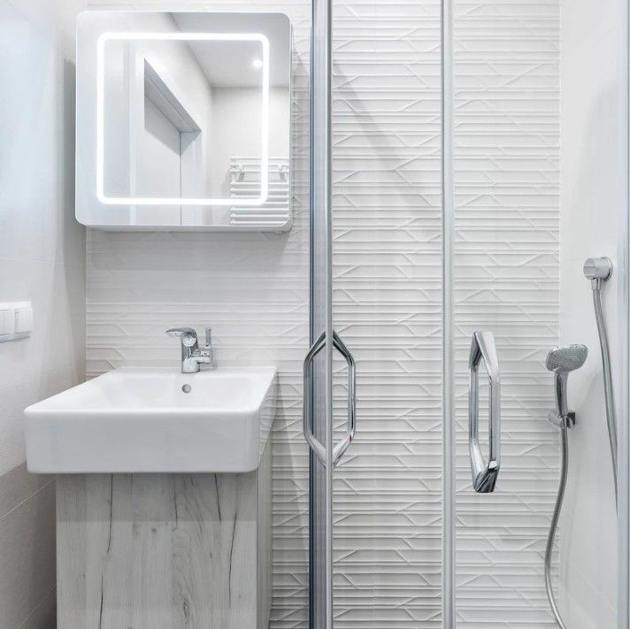 Derbyshire Specialists Group cloakroom conversion to a shower room with sink in Ilkeston