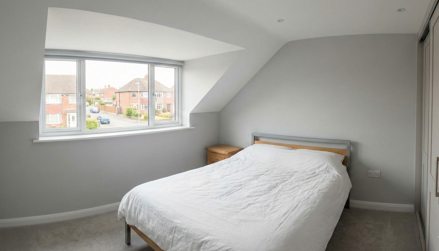 Newly finished dormer bedroom, a bright and modern space with a large window over the Derby suburbs.
