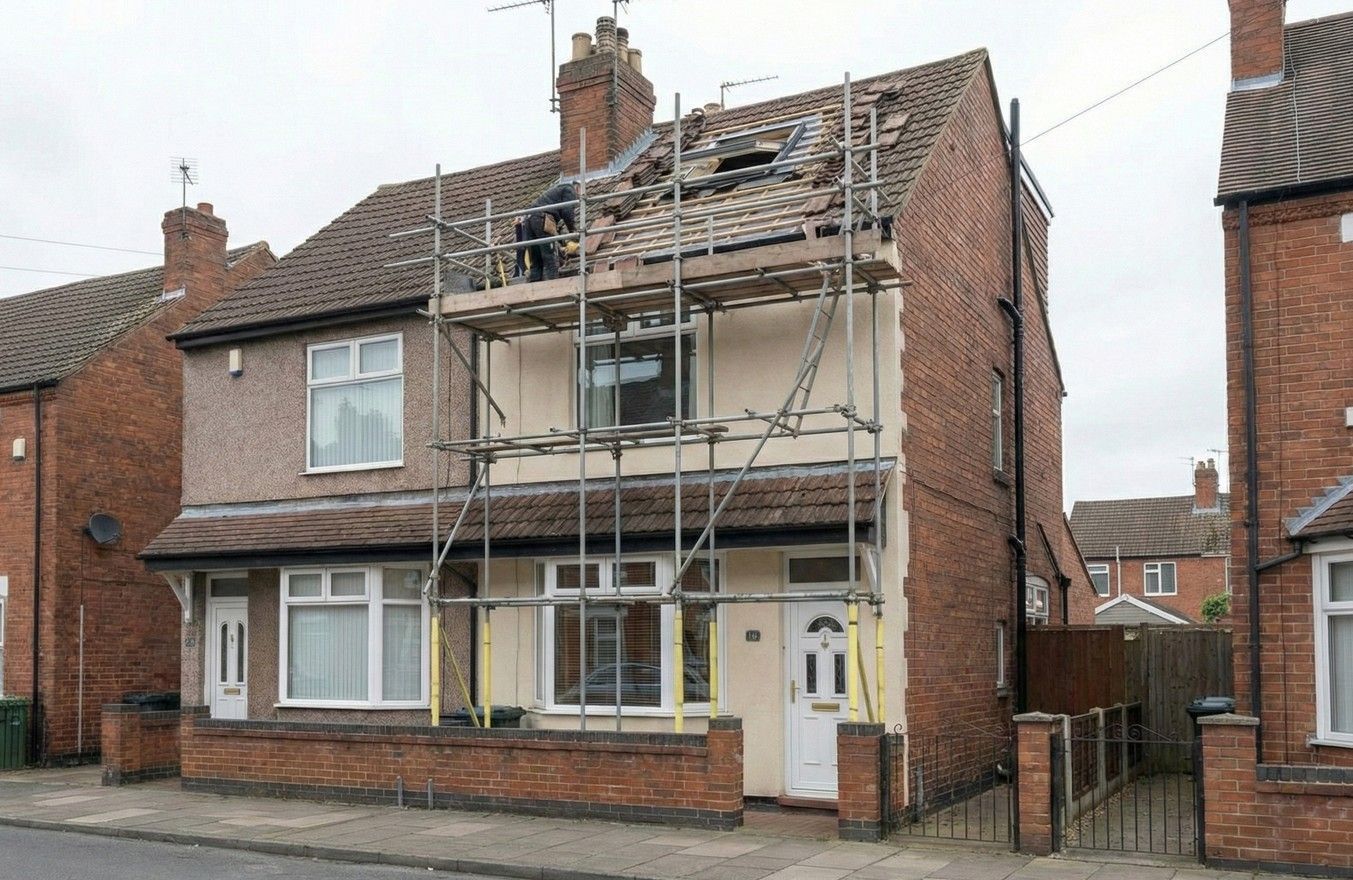 loft conversion in progress, installing the Velux window into the roof of a Derby house.